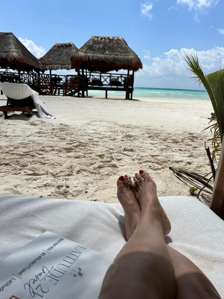 Person relaxing by the beach at El Dorado Maroma adult-only resort