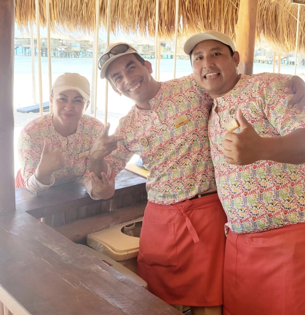 Smiling staff members at adult-only El Dorado Maroma Resort