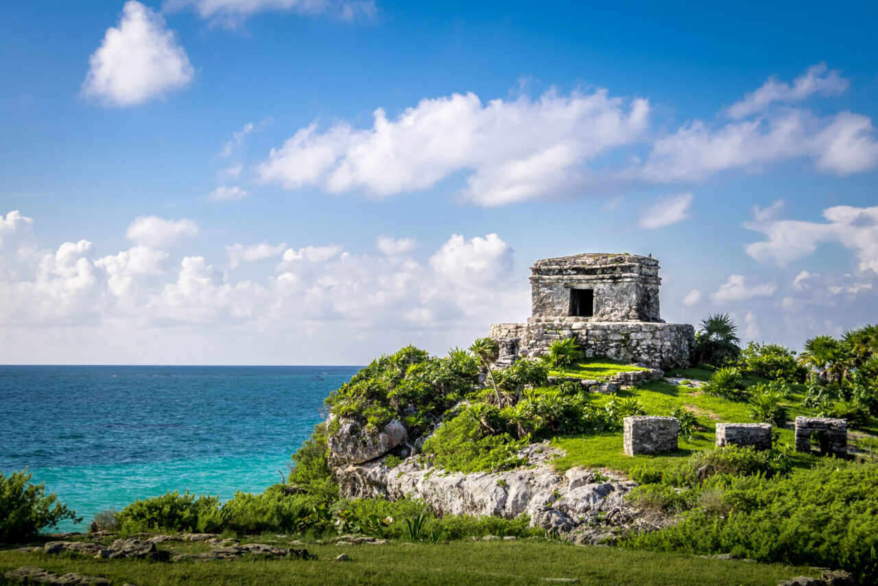 Turquoise Caribbean beach and Mayan ruins on Mexico's Riviera Maya, a romantic year-round honeymoon destination