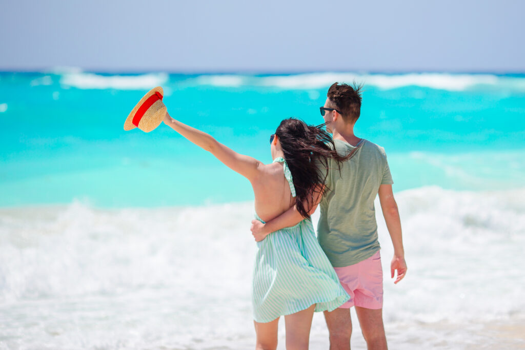 Honeymoon couple on the beach at an all inclusive Cancun resort