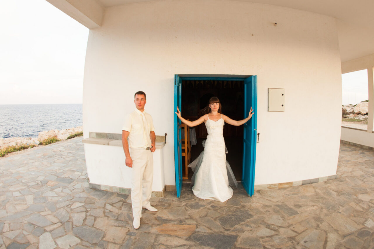 Bride and groom celebrating on their wedding day on a Greek island in Mykonos