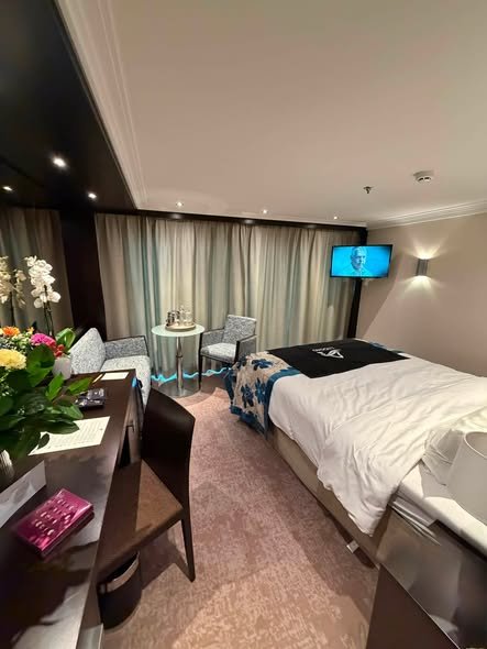 Avalon Vista Panorama Suite stateroom with sliding glass wall river view