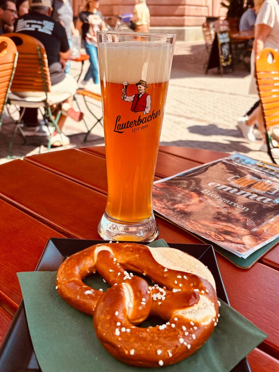 German wheat beer and a soft pretzel at a riverside cafe on the Rhine