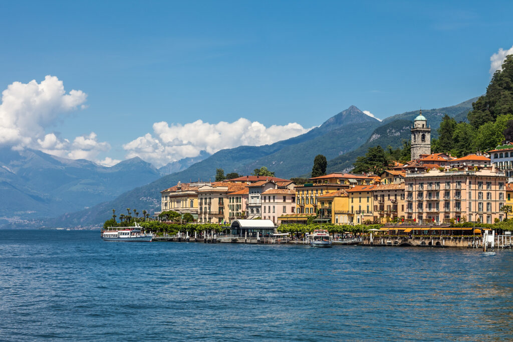 Bellagio's terracotta-roofed waterfront on Lake Como beneath forested mountains