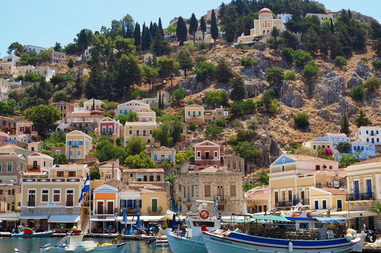 Boats in a Greek island harbour, where AI travel planning gets ferry routing wrong
