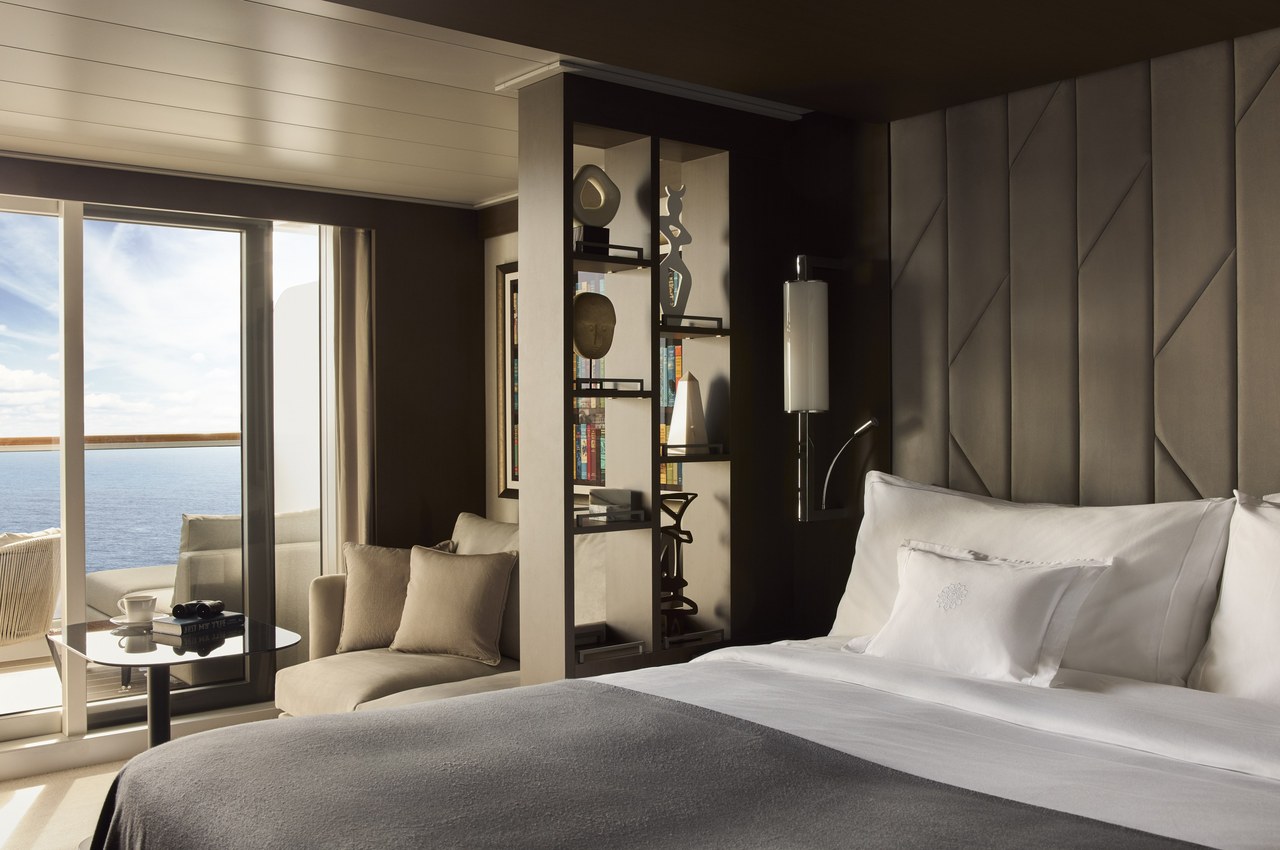 Ocean Terrace Suite with floor-to-ceiling windows and a private terrace on an Explora Journeys luxury small ship